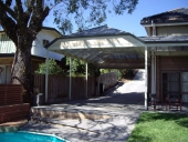 double-carport-matching-house-roof